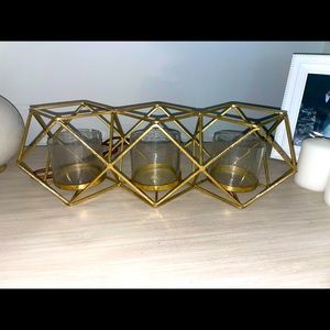 Gold candle centerpiece fits three pillar candles